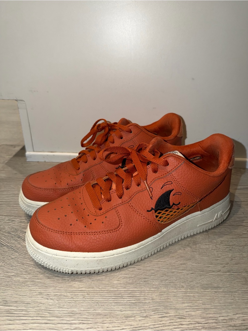 Nike Orange Low-Top Sneakers with Wave Graphic